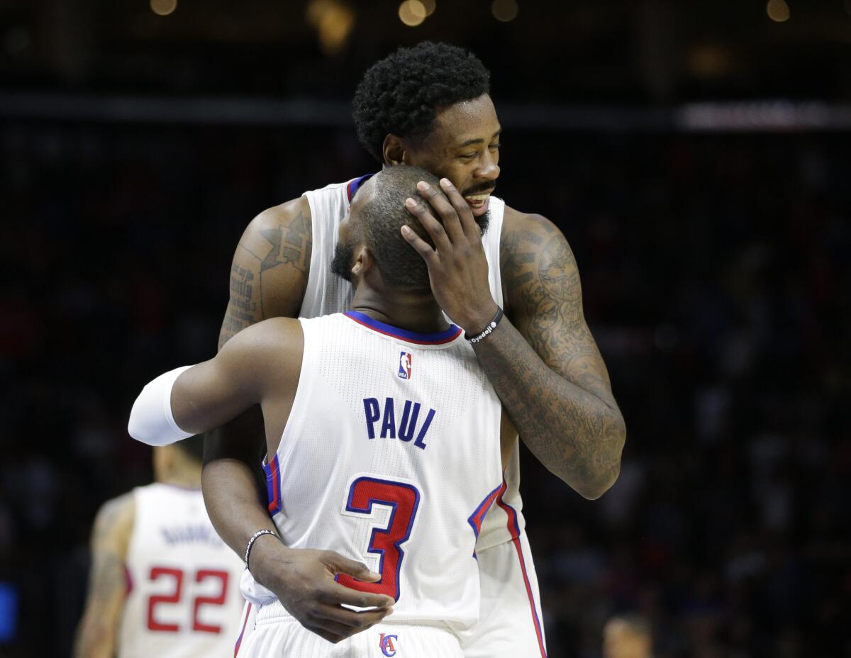 DeAndre Jordan hugs Chris Paul after the Clippers' 110-95 win over the Houston Rockets on Feb. 11.