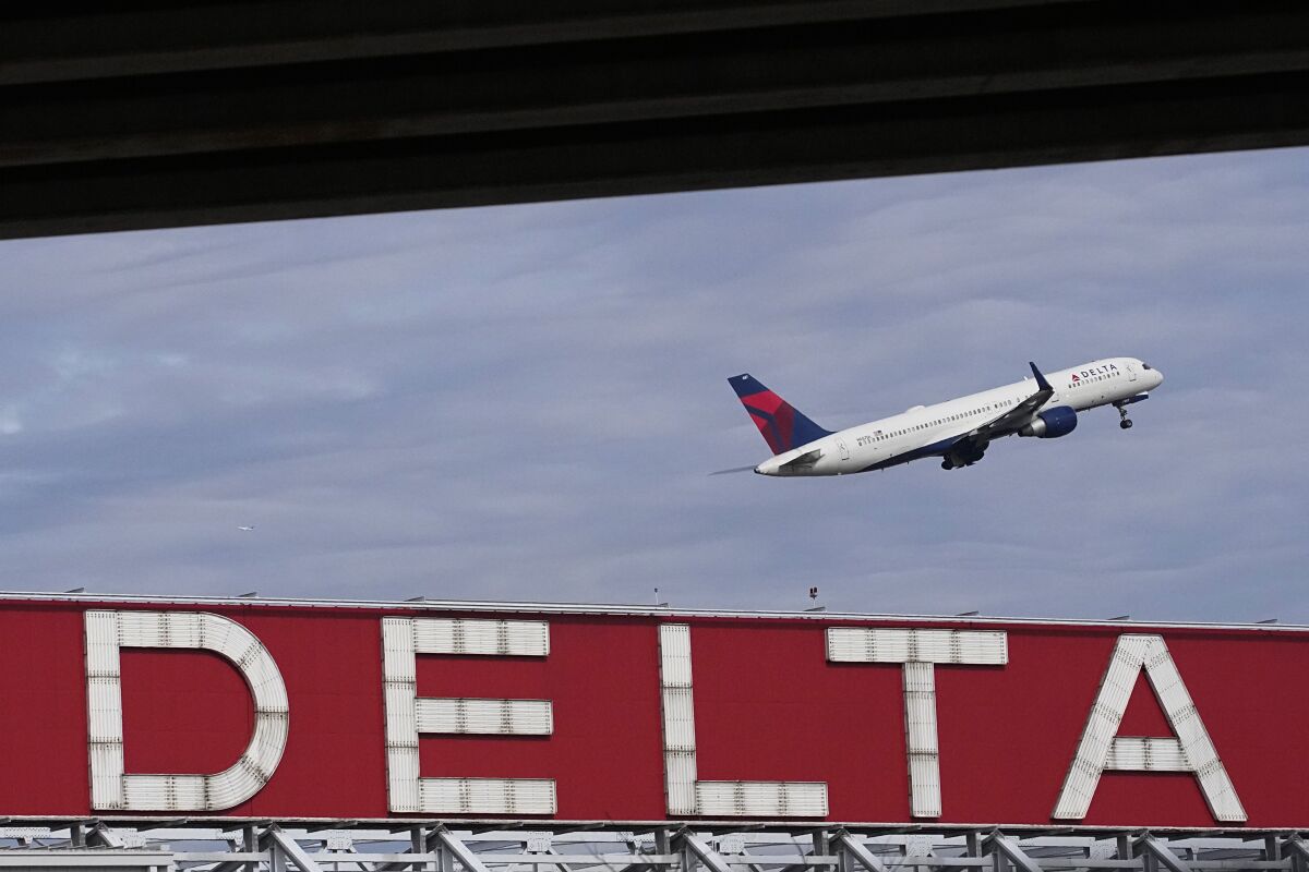 FILE - A Delta Air Lines plane takes off from Hartsfield-Jackson Atlanta International Airport in Atlanta, Nov. 22, 2022. Delta Air Lines said Tuesday, Feb. 7, 2023, that it will raise pay for its non-union employees by 5% on April 1, and increase a pool used for merit raises. (AP Photo/Brynn Anderson, File)
