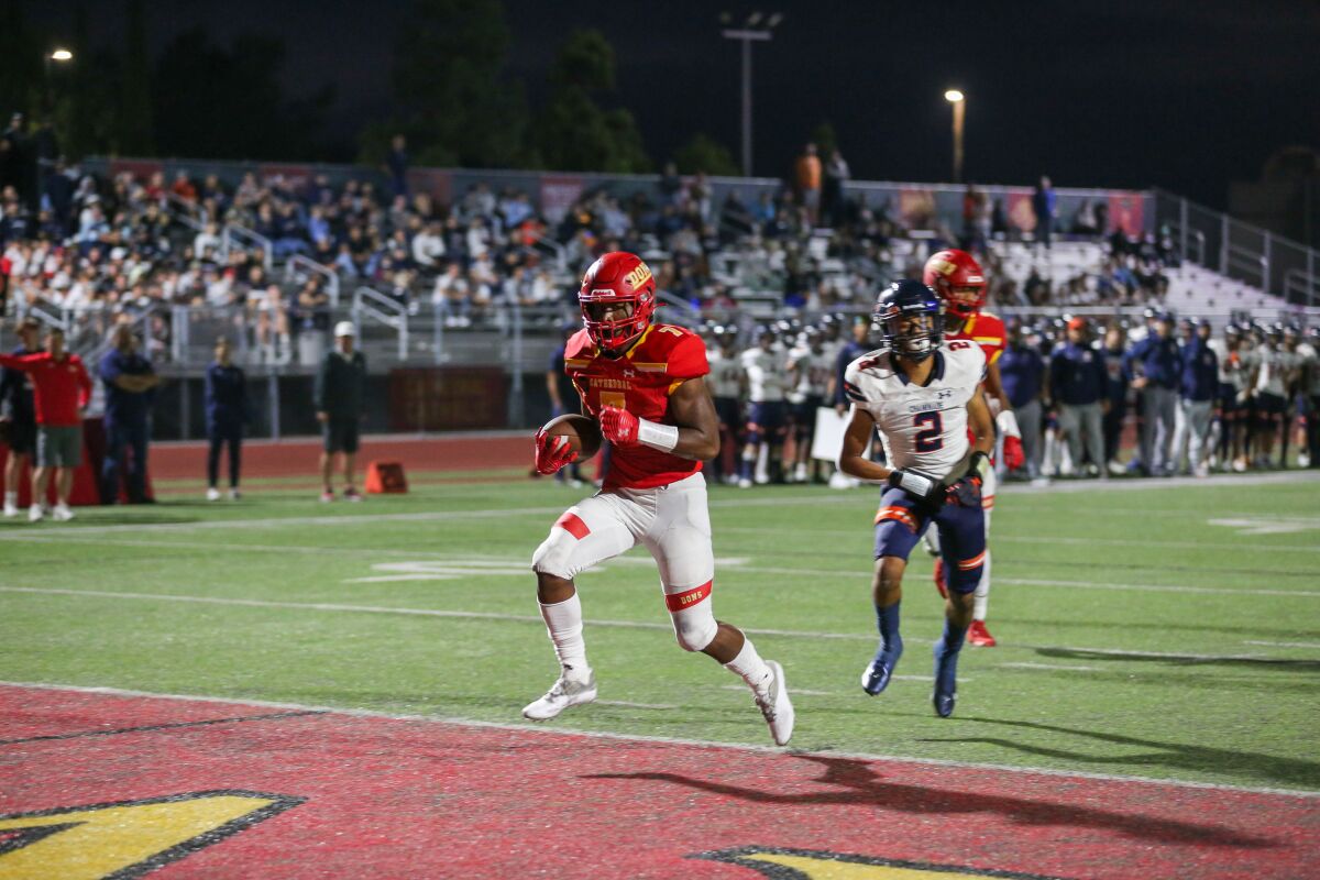 Cathedral Catholic's Lucky Sutton scores the first points of the game from 12 yards out against Mission Hills Chaminade.