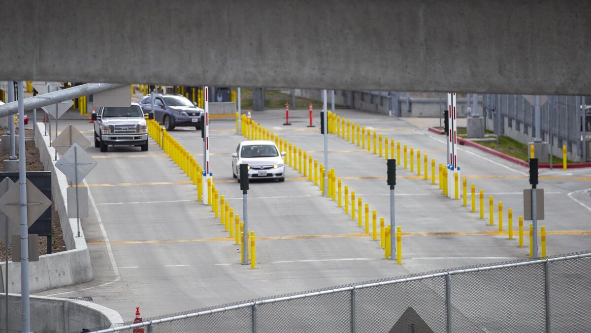 A trickle of cars made their way into the U.S. from Mexico at the San Ysidro crossing on Friday, March 20th, 2020.