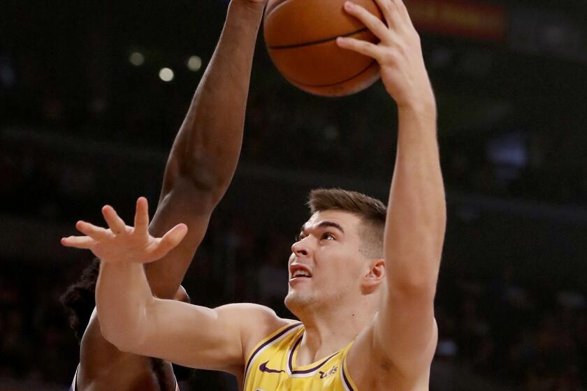LOS ANGELES, CALIF. - JAN. 29, 2019. lakers cebter Ivica Zubac goes to the basket against Sixers orward Joel Embid in the first quarter Tuesday night, Jan. 29, 2019, at Staples Center. (Luis Sinco/Los Angeles Times)