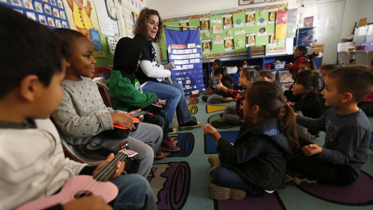 A teacher sings with her Pre-K students in Los Angeles on January 26, 2017.
