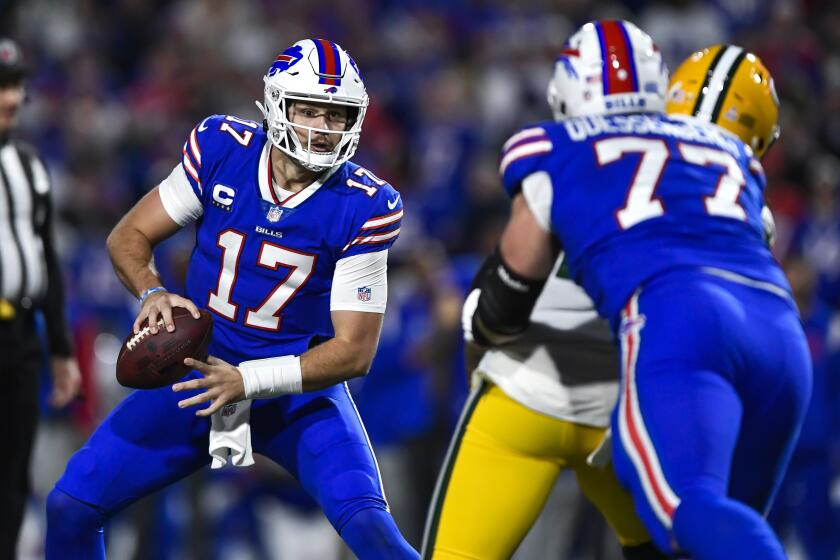 Buffalo Bills quarterback Josh Allen (17) looks to pass during the first half of an NFL football game against the Green Bay Packers in Orchard Park, N.Y., Sunday, Oct. 30, 2022. (AP Photo/Adrian Kraus)