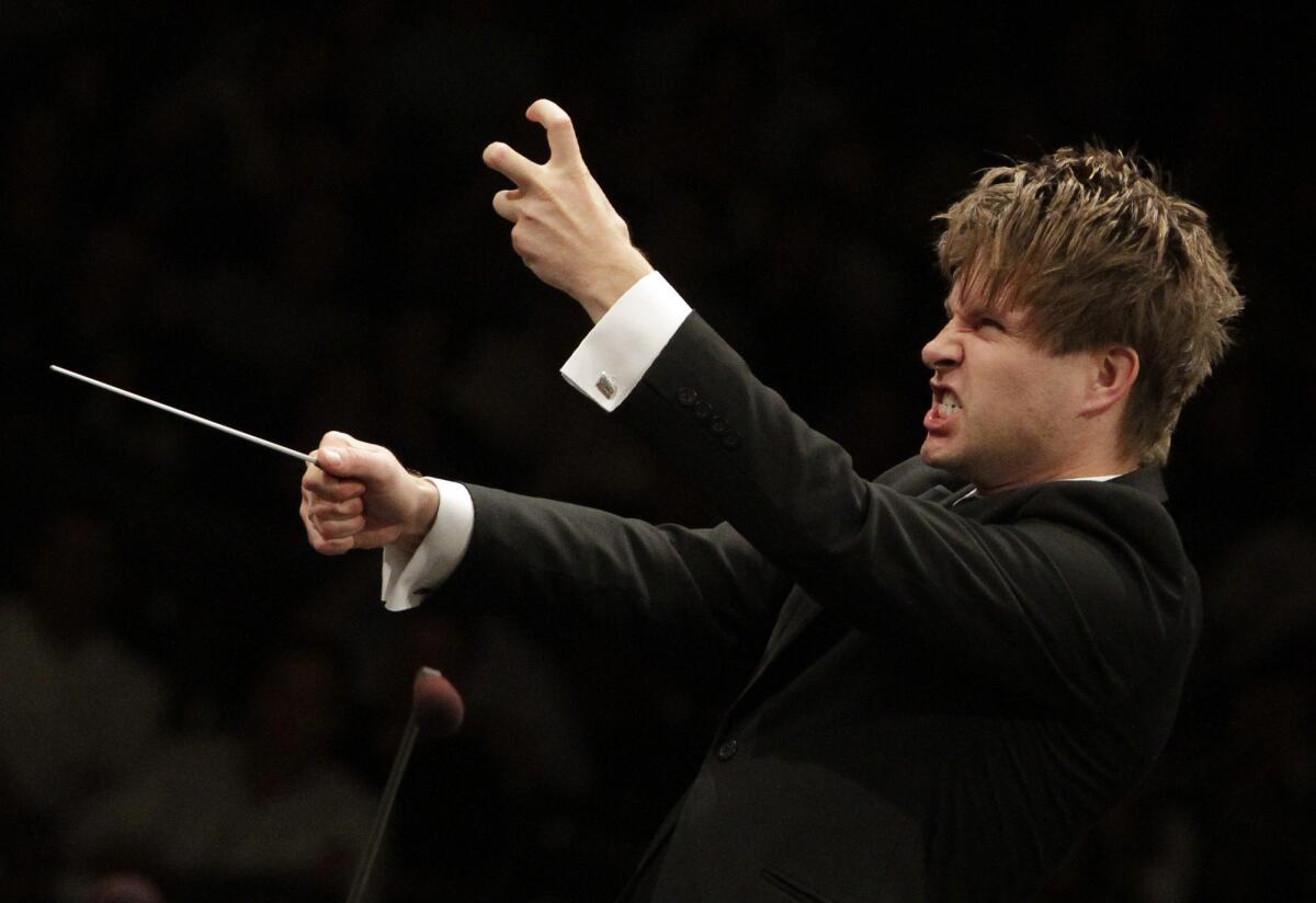 In this 2012 file photo, Krzysztof Urbanski conducts the L.A. Phil in his West Coast debut at the Hollywood Bowl in Hollywood on Sep. 04.