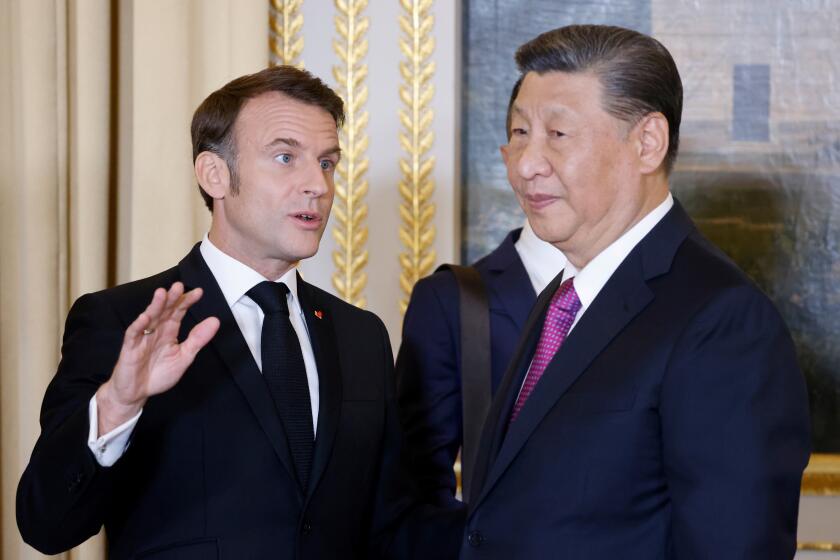 French President Emmanuel Macron talks with Chinese President Xi Jinping during a a state dinner at the Elysee Palace in Paris, Monday, May 6, 2024. French President Emmanuel Macron put trade disputes and Ukraine-related diplomatic efforts on top of the agenda for talks with Chinese President Xi Jinping, who arrived in France for a two-day state visit opening his European tour. (Ludovic Marin, Pool via AP)