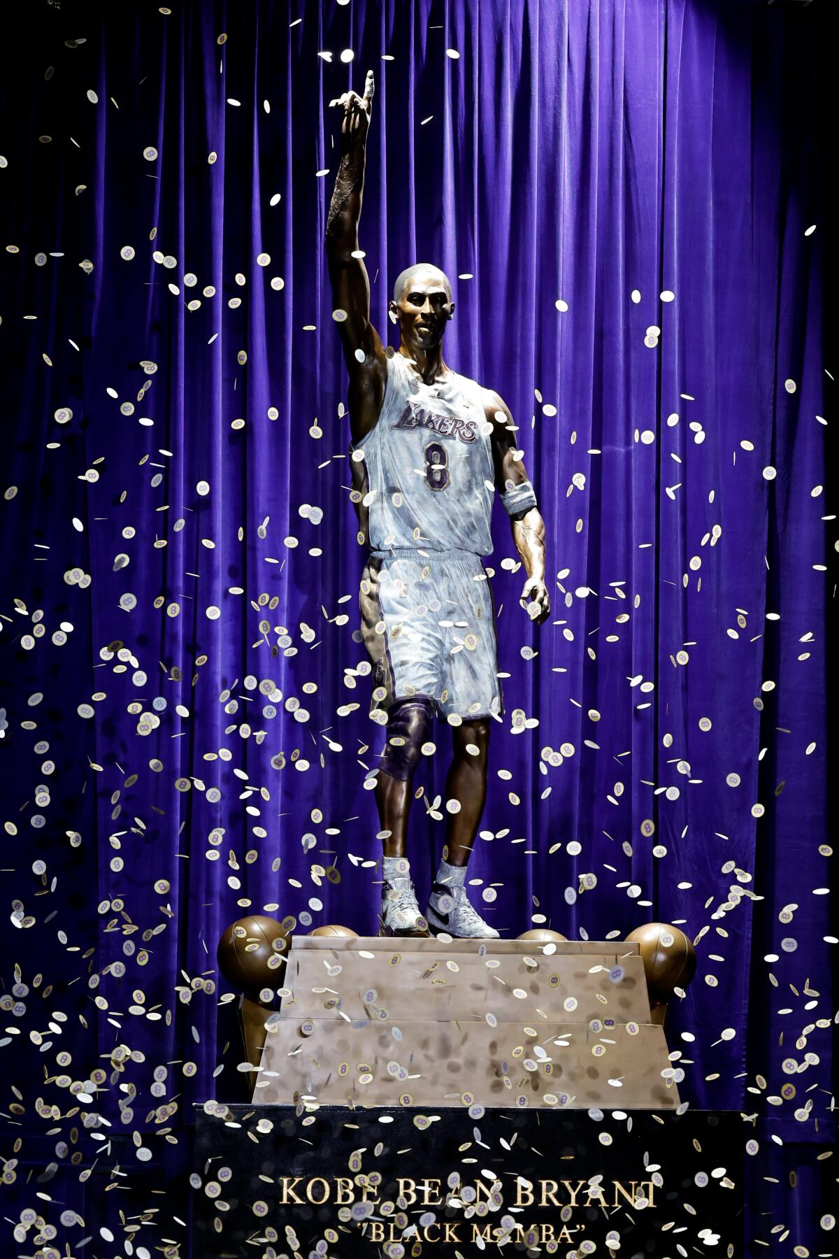 Confetti falls as the Lakers unveil a statue of Kobe Bryant during a ceremony outside Crypto.com Arena on Thursday.