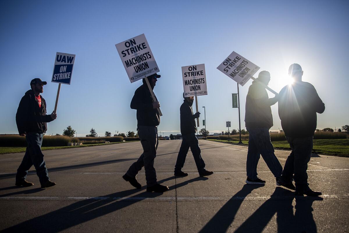 United Auto Workers picket outside of John Deere Des Moines Works on Thursday, Oct. 14, 2021, in Ankeny, Iowa. The Deere workers' strike began at midnight. (Kelsey Kremer /The Des Moines Register via AP)