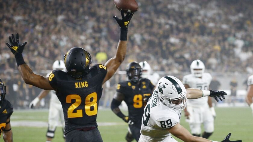 Arizona State defensive back Demonte King (28) tips a pass intended for Michigan State tight end Matt Dotson (89) during the first half on Saturday in Tempe, Ariz.