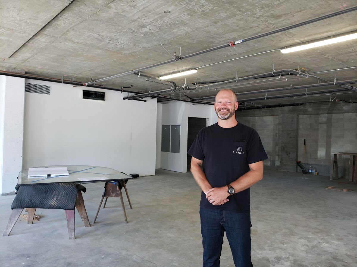 Todd Noe stands in the vacant ground floor of a new mixed-use development in La Jolla Shores.