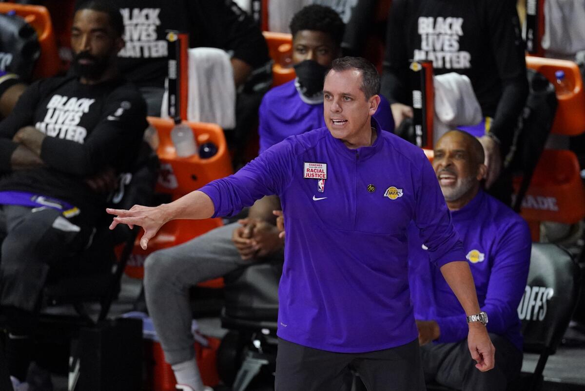 Lakers coach Frank Vogel directs his team during a playoff game against the Rockets.
