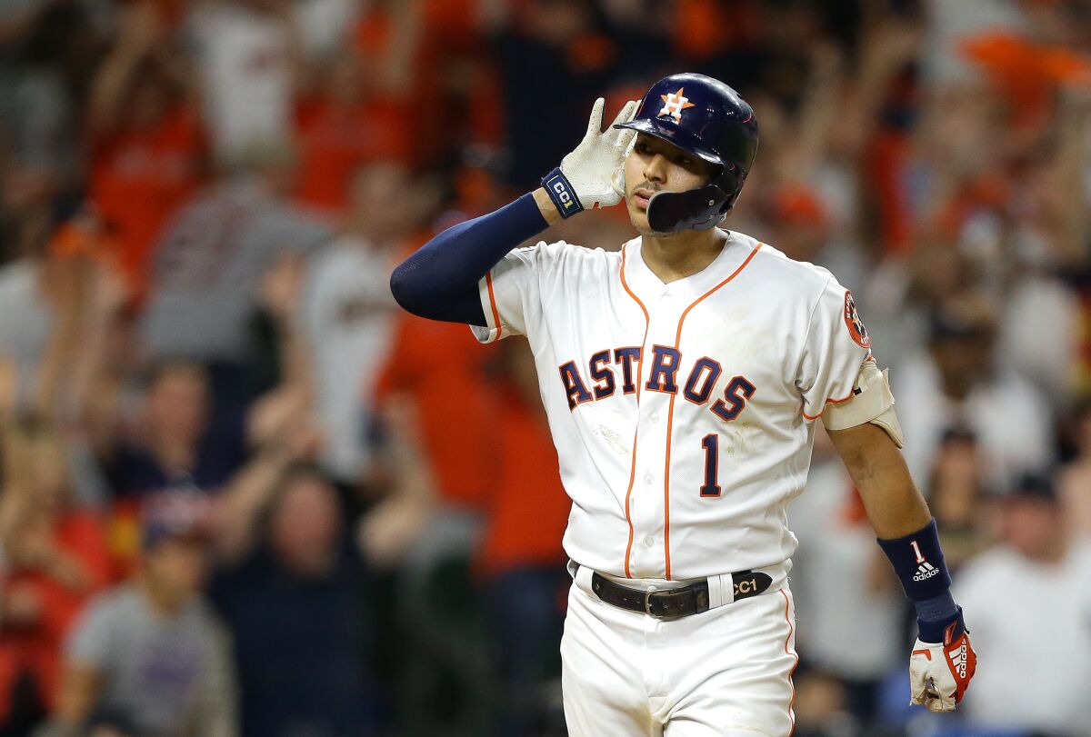 Houston's Carlos Correa celebrates after hitting a walk-off solo home run during the eleventh inning against the New York Yankees on Sunday in Game 2 of the ALCS.