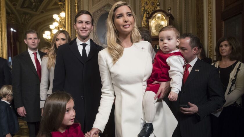 Ivanka Trump with two of her children and husband Jared Kushner.
