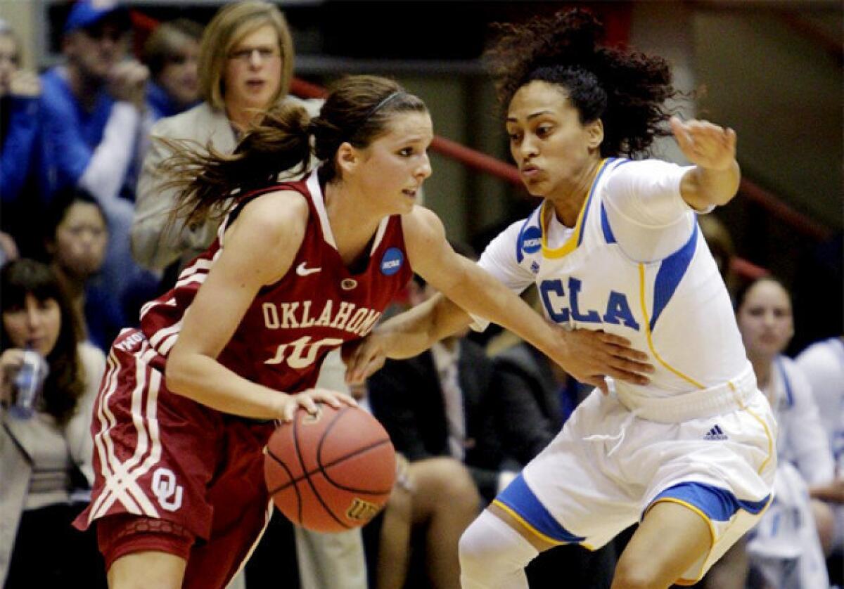 Oklahoma's Morgan Hook, left, dribbles upcourt as UCLA's Mariah Williams defends during the first half.