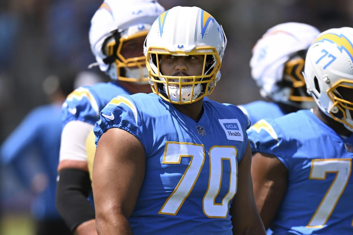 Chargers left tackle Rashawn Slater looks across the field during training camp on Friday in El Segundo.
