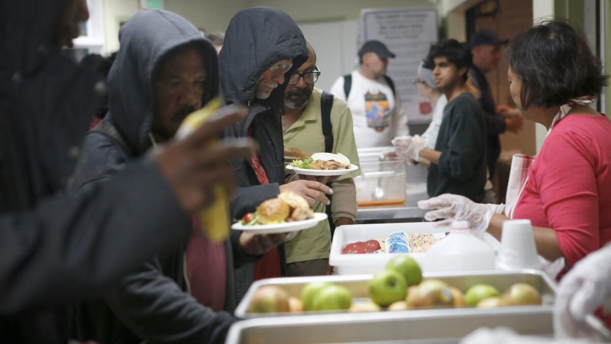 People stand in line for a meal at the Salvation Army shelter in Hollywood.