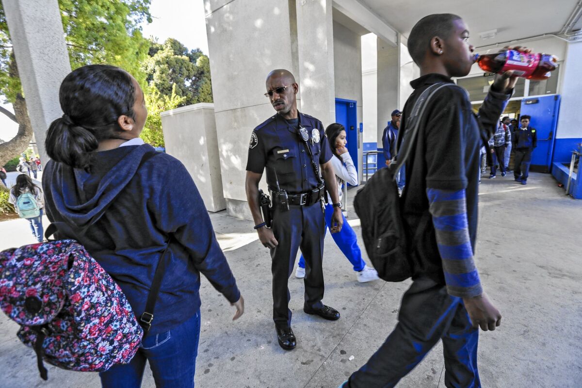 Los Angeles School police Officer Henry Anderson on his beat at Robert E. Peary Middle School in Gardena.
