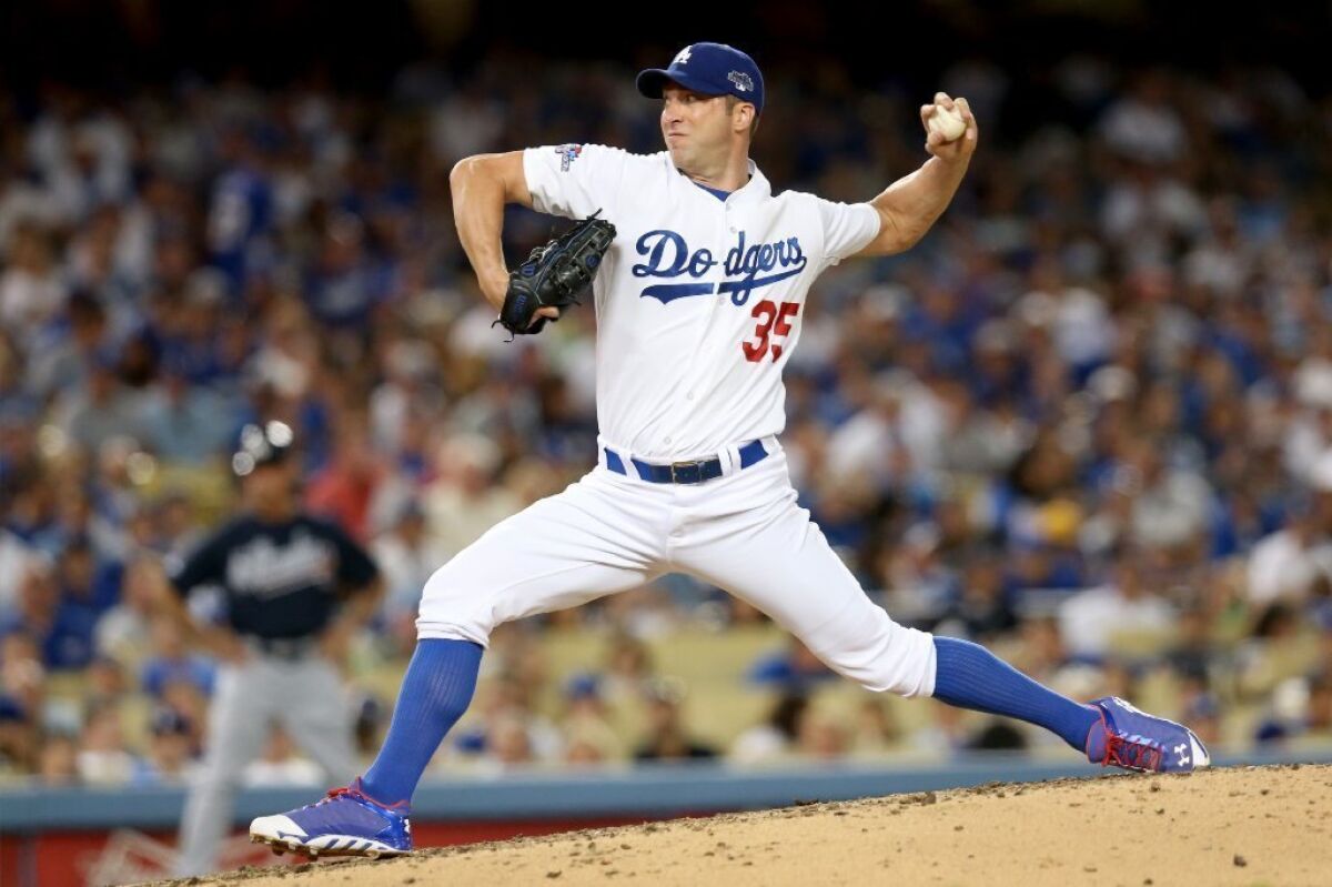 Chris Capuano pitches for the Dodgers in the fourth inning of Game 3 of the National League Division Series against the Atlanta Braves on Oct. 6.