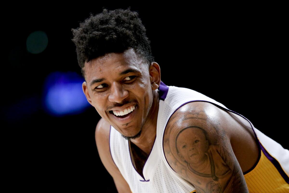 Los Angeles Lakers forward Nick Young smiles during the second half of an NBA basketball game against the Boston Celtics in Los Angeles, Sunday, Feb. 22, 2015. The Los Angeles Lakers won 118-111 in overtime. (AP Photo/Chris Carlson) ORG XMIT: otkcc142