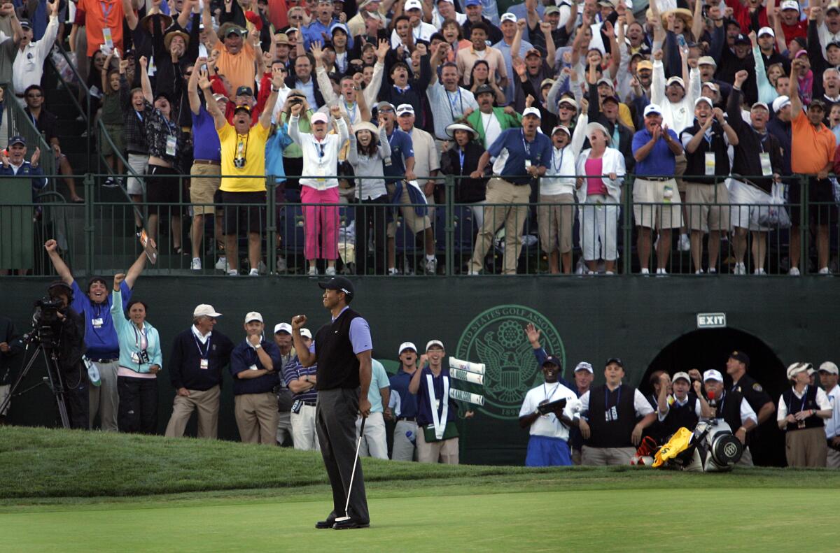 Tiger Woods celebrates an eagle on the 18th green in the 3rd round at U.S. Open at Torrey Pines on Saturday, June 14, 2008.