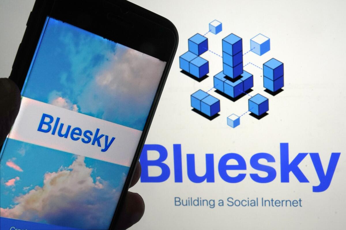 The app for Bluesky is shown on a mobile phone, left, and on a laptop screen.