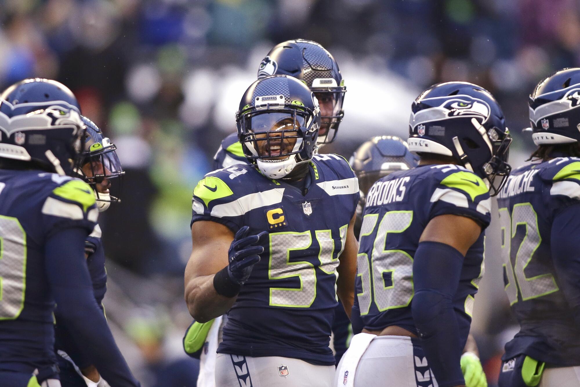 Seattle Seahawks middle linebacker Bobby Wagner (54) stands with teammates against the Chicago Bears last aseason.