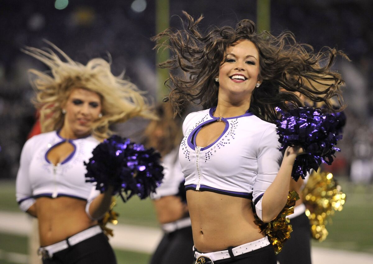 In this 2011 file photo, Baltimore Ravens cheerleaders including Courtney Lenz, right, cheer on team during a game against the San Francisco 49ers.