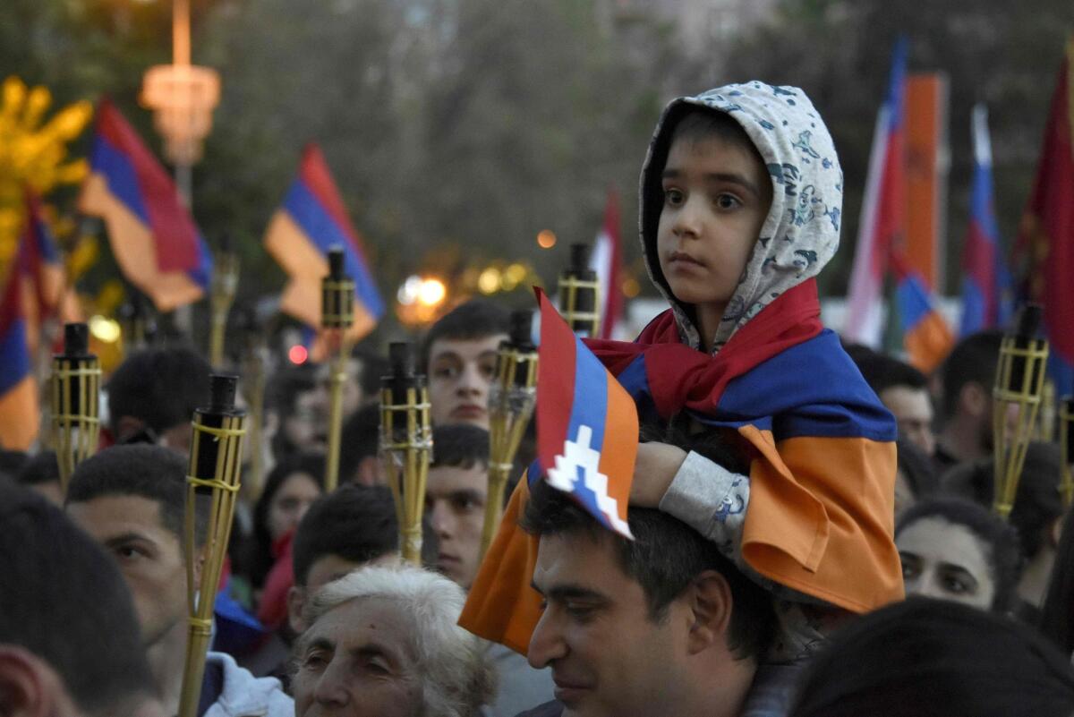Armenian people take part in a march in commemoration of the 101st anniversary of the mass killings of Armenians by Ottoman forces in 1915. It is 101 years on April 24 since Turkey's Ottoman government began arresting minority community leaders and setting in motion a campaign of systematic slaughter that had left 1.5 million Christian Armenians dead by the early 1920s.
