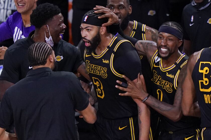 Los Angeles Lakers' Anthony Davis (3) celebrates with teammates after an NBA conference final playoff basketball game.