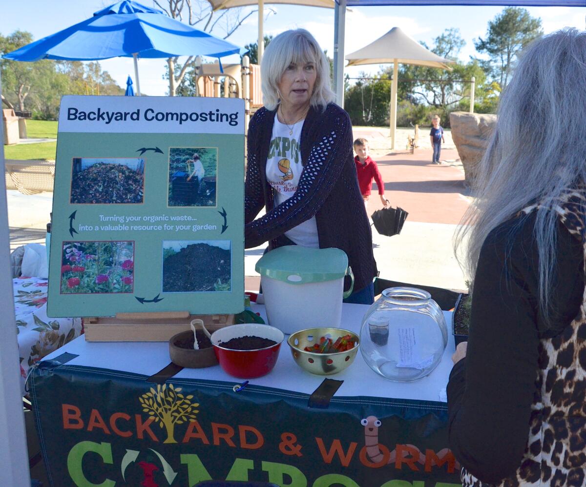 Lisa Ryder of Waste Management demonstrates backyard composting.