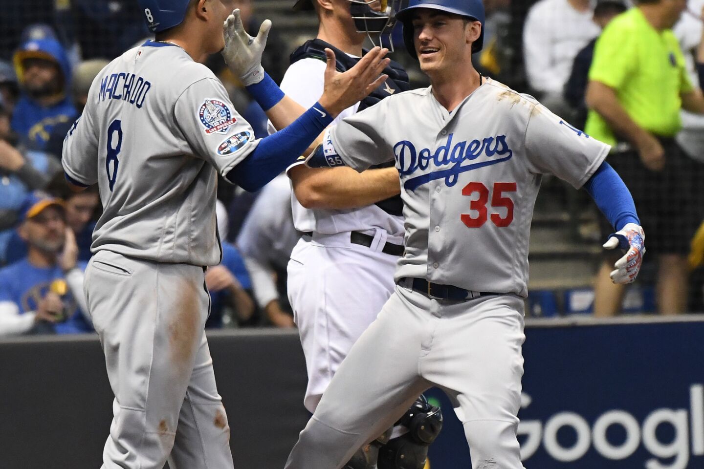 Dodgers Cody Bellinger celebrates with Manny Machado after hitting a two run homerun the second inning.