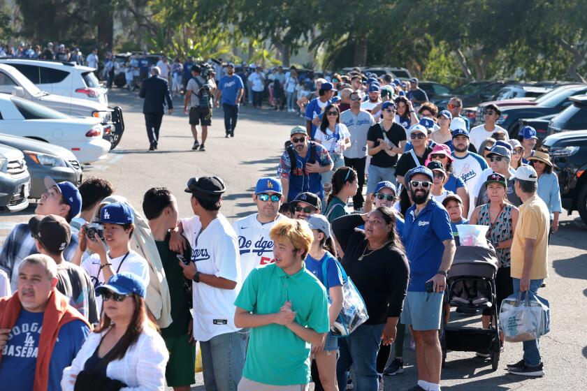 Los Angeles, California August 28, 2024-Fans arrive early for to get there bobblehead of Dodgers player Shohei Ohtani before a game with the Orioles at Dodger Stadium Wednesday. (Skalij/Los Angeles Times)