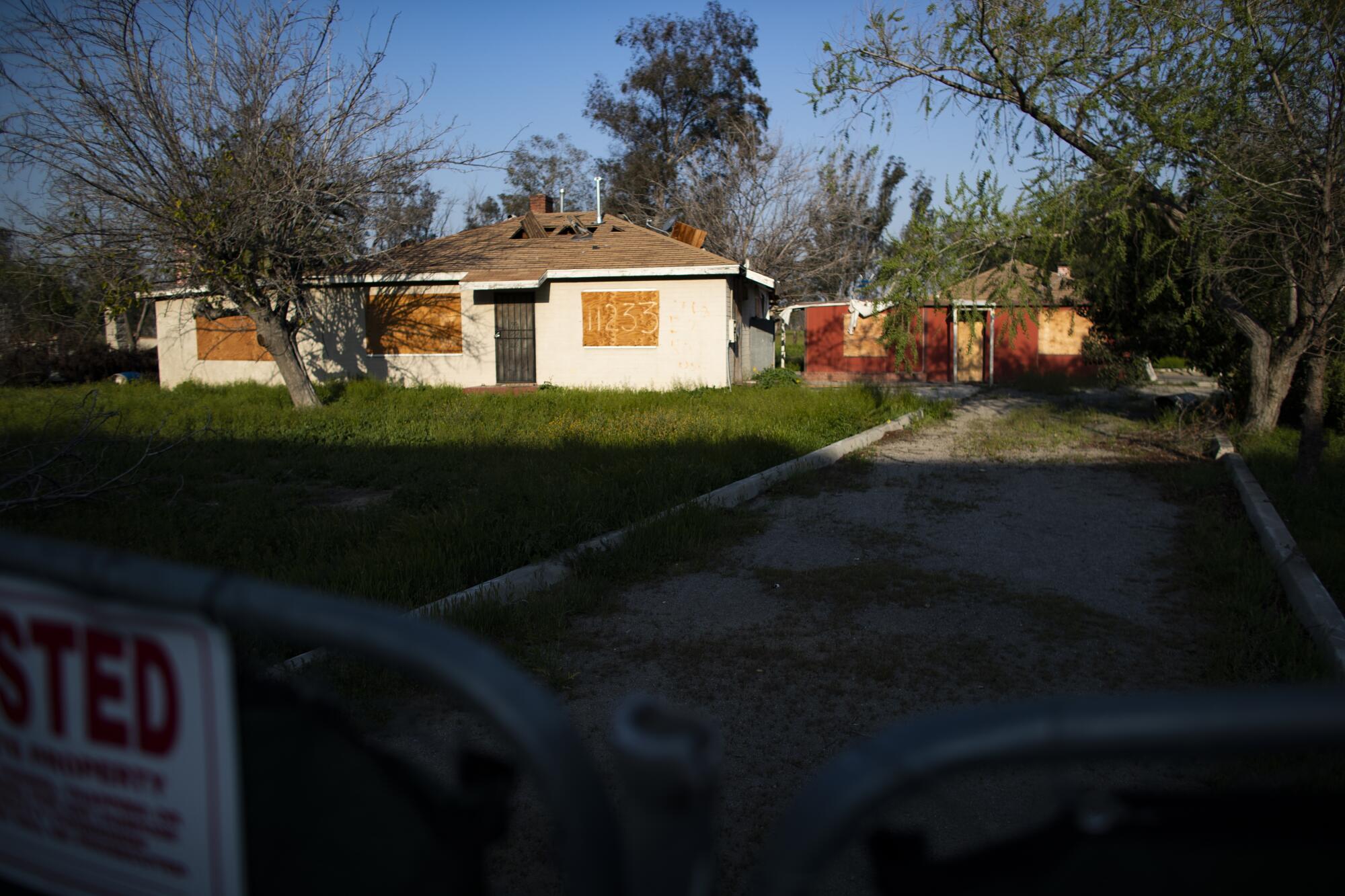 Boarded-up homes in Fontana will be replaced by warehouses.