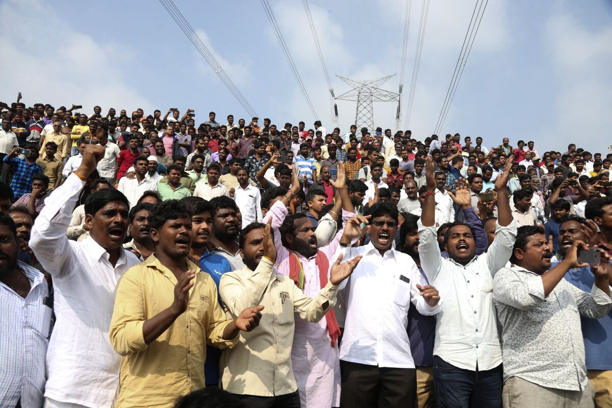 Hundreds gather Dec. 6 at a crime scene in Shadnagar, India, to show support for police after the fatal shootings of four suspects. The rape and murder of a 27-year-old woman has sparked protests across India.