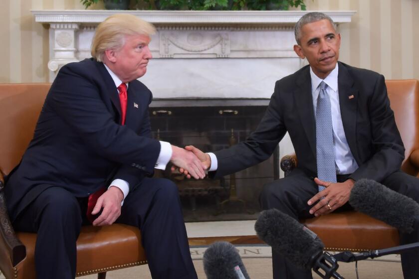 Former President Barack Obama and President Donald Trump shake hands during a transition planning meeting in the Oval Office at the White House on November 10, 2016 in Washington, D.C.
