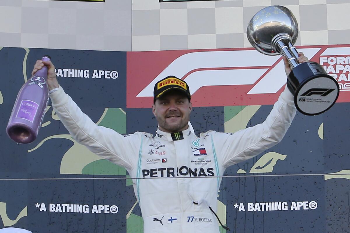 Formula One driver Valtteri Bottas celebrates on the podium after winning the Japanese Grand Prix on Sunday.