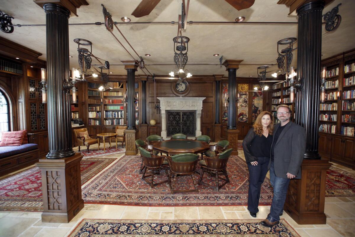 Screenwriters Miller and Marlow took a cue from Hogwarts when they built their home library.
