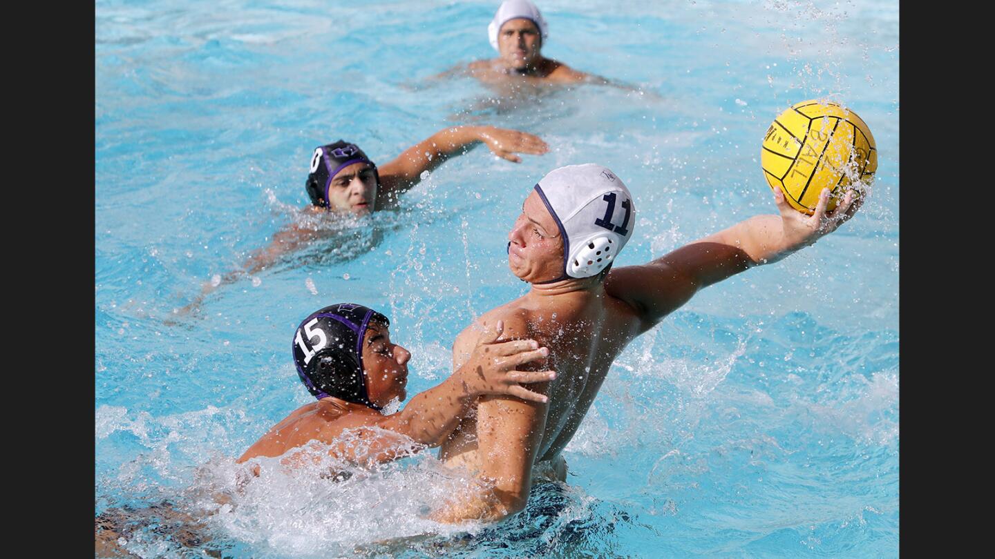 Hoover High School's #15 Samvel Manukyan makes it difficult to take a shot on goal in home game vs. Crescenta Valley High School and #11 David Komjathy, at HHS in Glendale on Tuesday, Oct. 3, 2017.