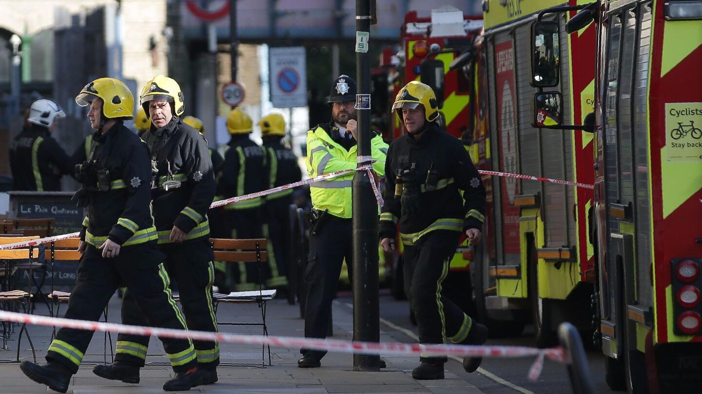 Emergency responders work outside Parsons Green Underground station in London after Friday's explosion.