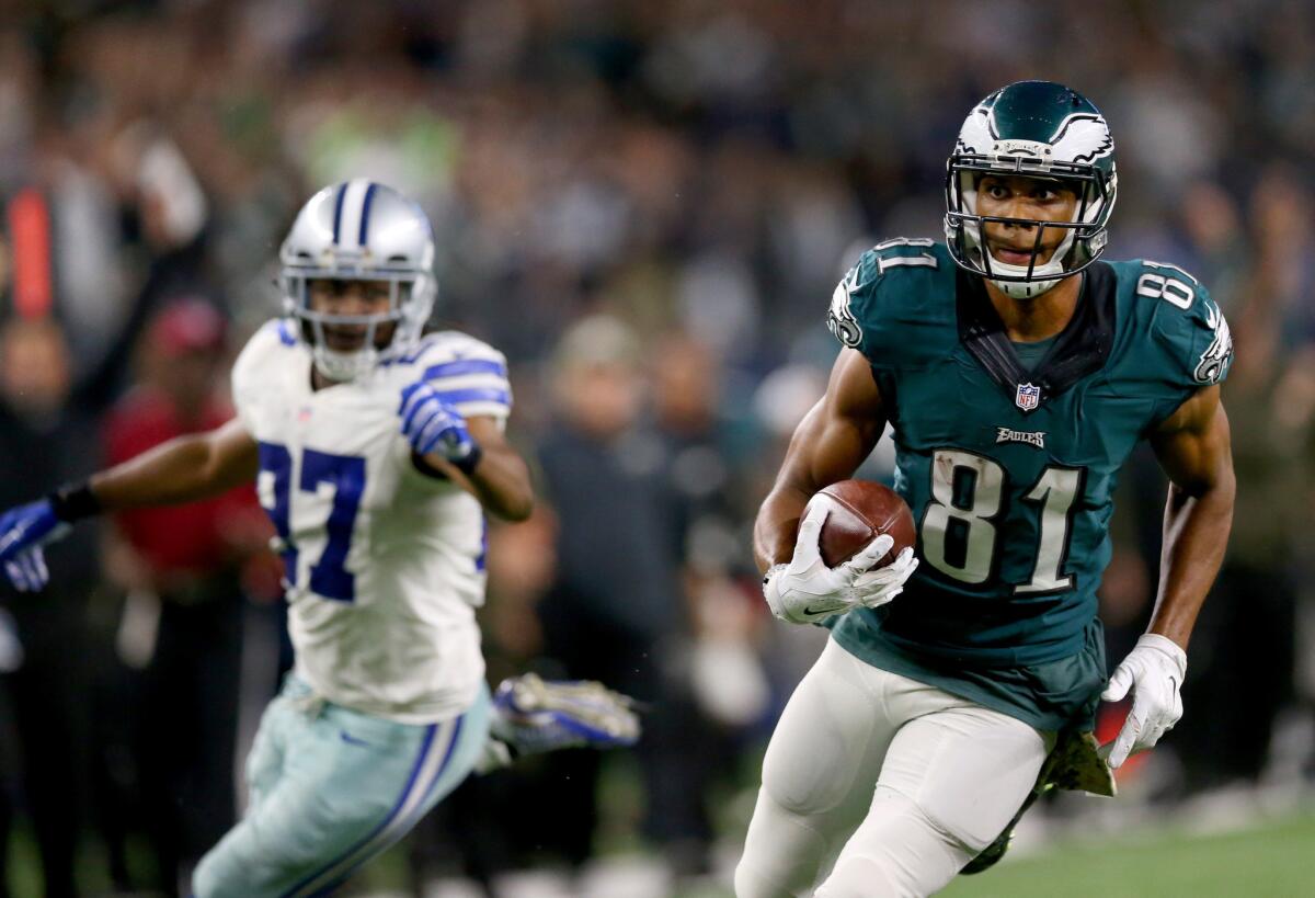 Eagles receiver Jordan Matthews runs past Cowboys defensive back J.J. Wilcox to score the game-winning touchdown in overtime.