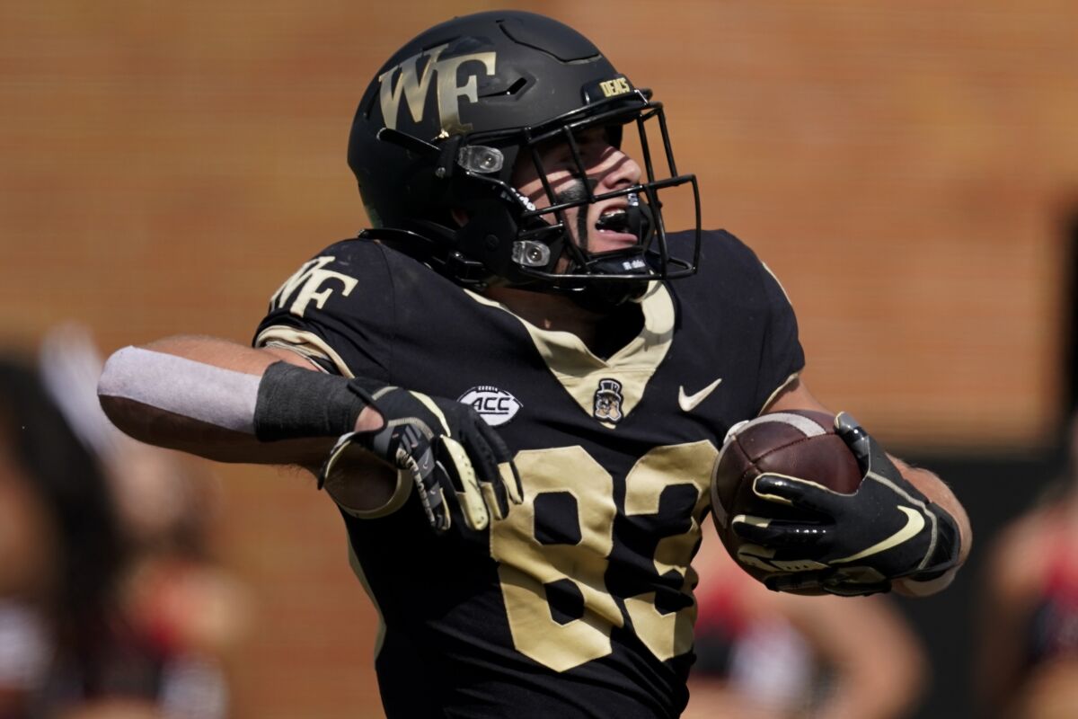 Wake Forest wide receiver Taylor Morin celebrates after scoring against Louisville during the first half of an NCAA college football game on Saturday, Oct. 2, 2021, in Winston-Salem, N.C. (AP Photo/Chris Carlson)