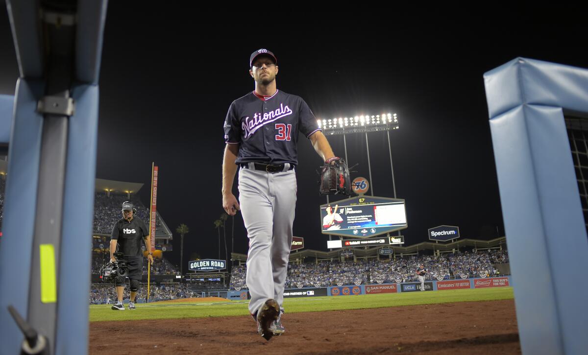 Washington Nationals pitcher Max Scherzer walks to the dugout after the eighth inning in Game 2 of the NLDS.