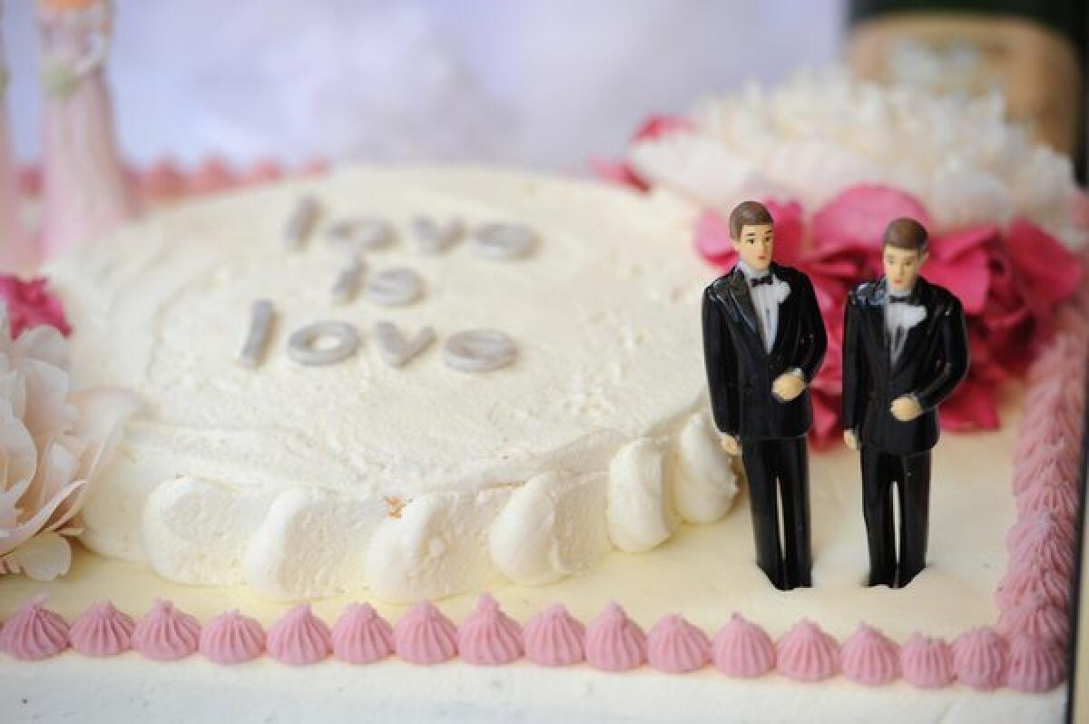 A wedding cake with a male couple is seen at The Abbey restaurant at a celebration of the more than 100 same-sex marriages performed in West Hollywood, Calif.