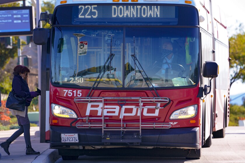  A passenger boards the Rapid 225 bus on Thursday, Feb. 24, 2022 in Chula Vista 