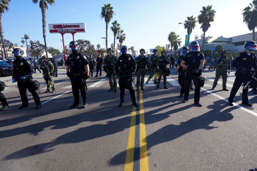 SAN DIEGO, CA - JANUARY 07: On Thursday, Jan. 9, 2021 in San Diego, CA., at Pacific Beach in San Diego, after a clash with Antifa, SDPD officers take up positions on Mission Blvds. (Nelvin C. Cepeda / The San Diego Union-Tribune)