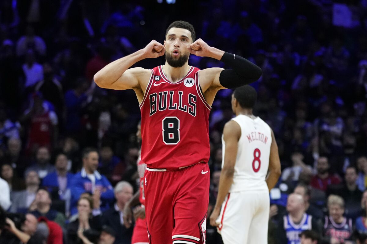 Chicago Bulls' Zach LaVine, left, reacts after a foul call during double overtime in an NBA basketball game against the Philadelphia 76ers, Monday, March 20, 2023, in Philadelphia. (AP Photo/Matt Slocum)