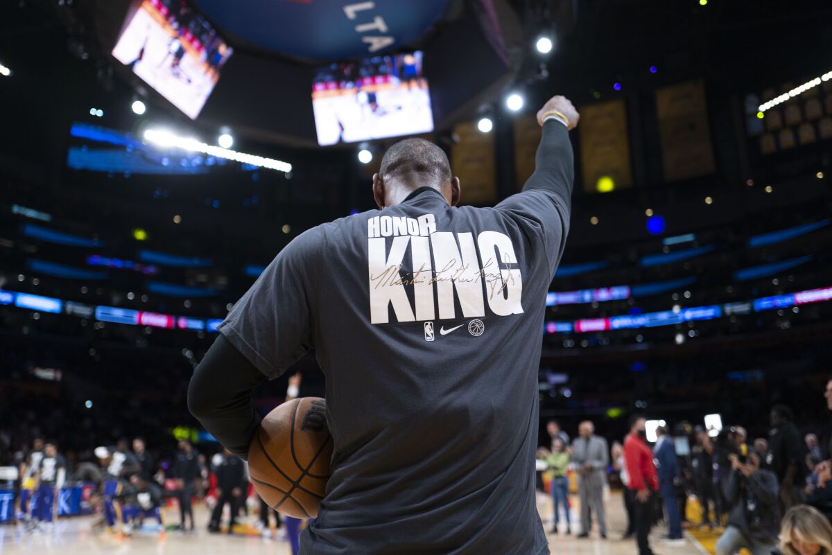 LeBron James wears a jersey celebrating the legacy of Martin Luther King Jr. during pregame warmups Monday.