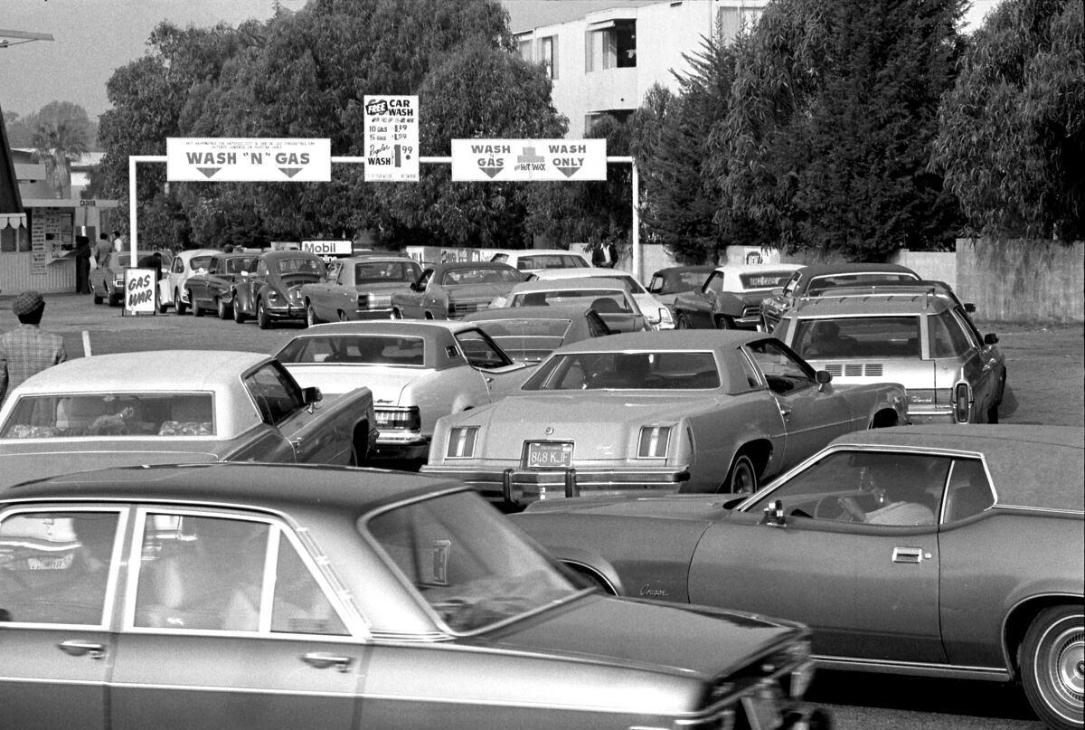 A crush of cars wait in line at a gas station and car wash in L.A.