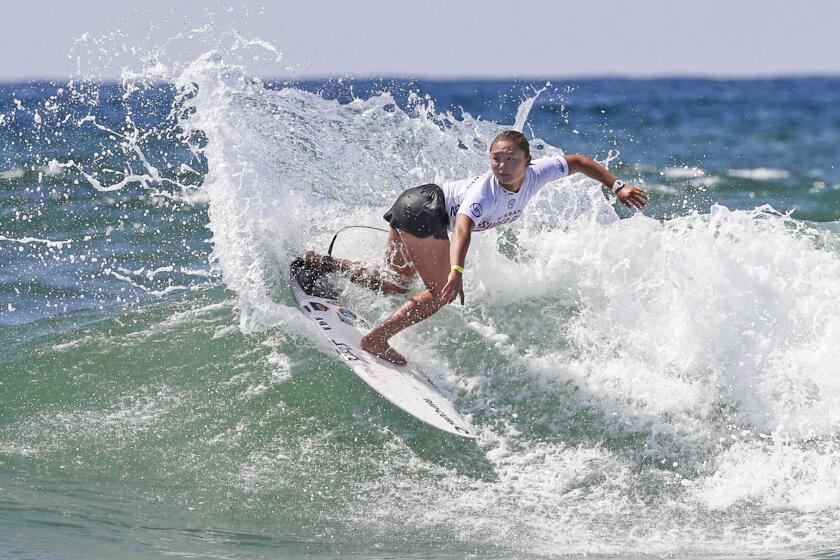 Anon Matsuoka competes during the first day of the Super Girl Surf Pro competition at Oceanside Pier.