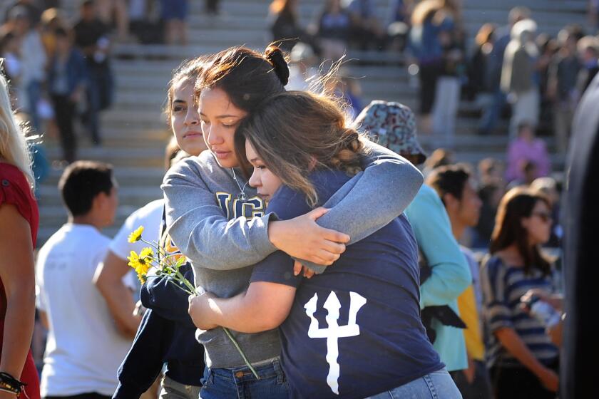 Students hug after a recent memorial service at UC Santa Barbara for six students slain May 23 in Isla Vista, Calif.