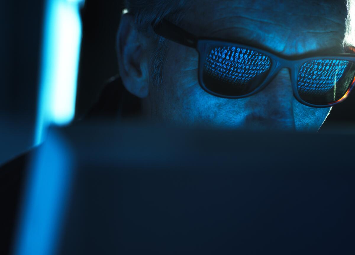 Words from a computer screen are reflected on sunglasses